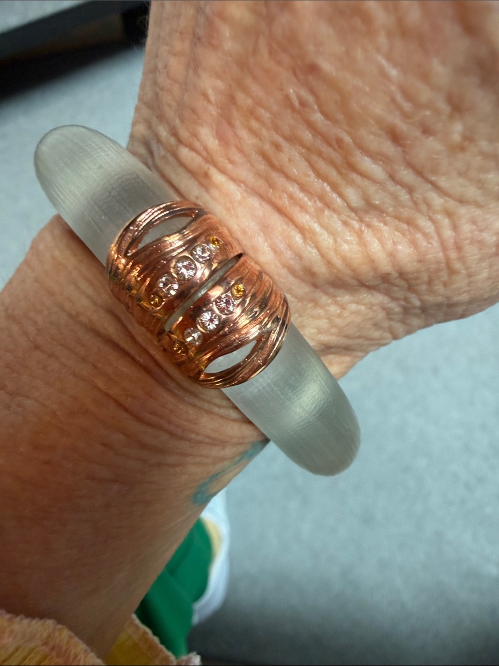 Rose Gold Crystal Accent Bangle Bracelet With
Amber crystals Clear Lucite